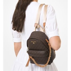 Michael Kors Sig Slater EX Sm CONVT Messenger Backpack. Used Very Good Condition